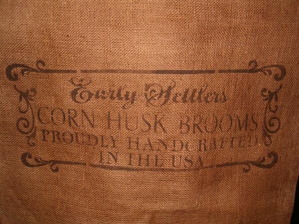 large cornhusk brooms burlap sack