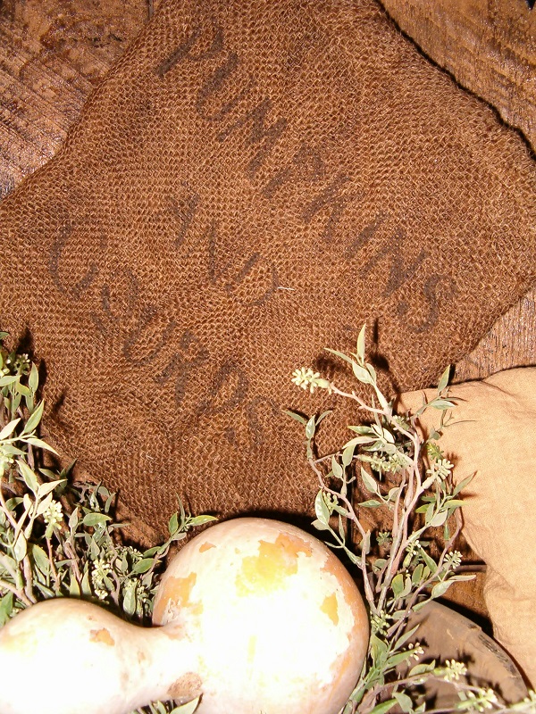 small pumpkins and gourds burlap sack