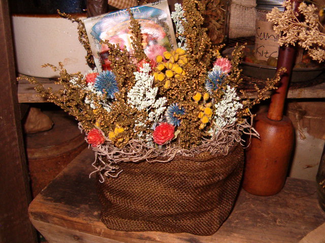 Floral stuffed burlap sack sitter