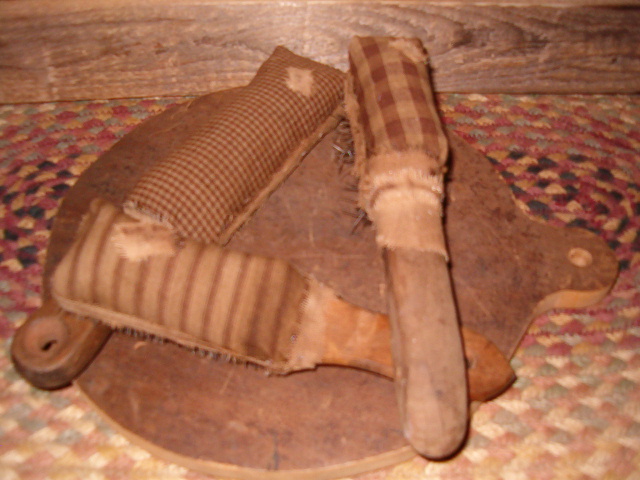 Set of three fabric wrapped brushes