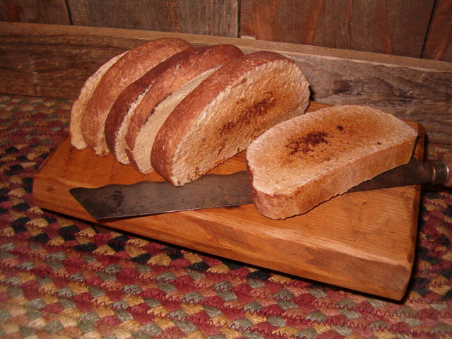 half small sliced bread on handmade riser