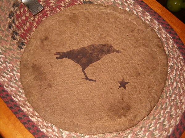 crow candle mat