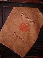 large homegrown pumpkins burlap sack