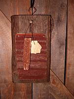 Hanging rub board with lye soap and corn cobb