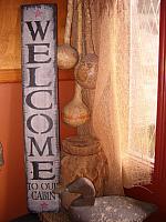 Welcome to our cabin vertical sign